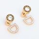 Gold Tone Logo Floater Stud Earrings - Image 1 - please select to enlarge image